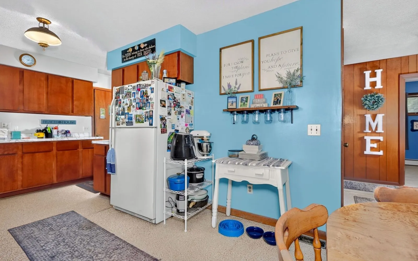 Kitchen with wood cabinets and a dining table
