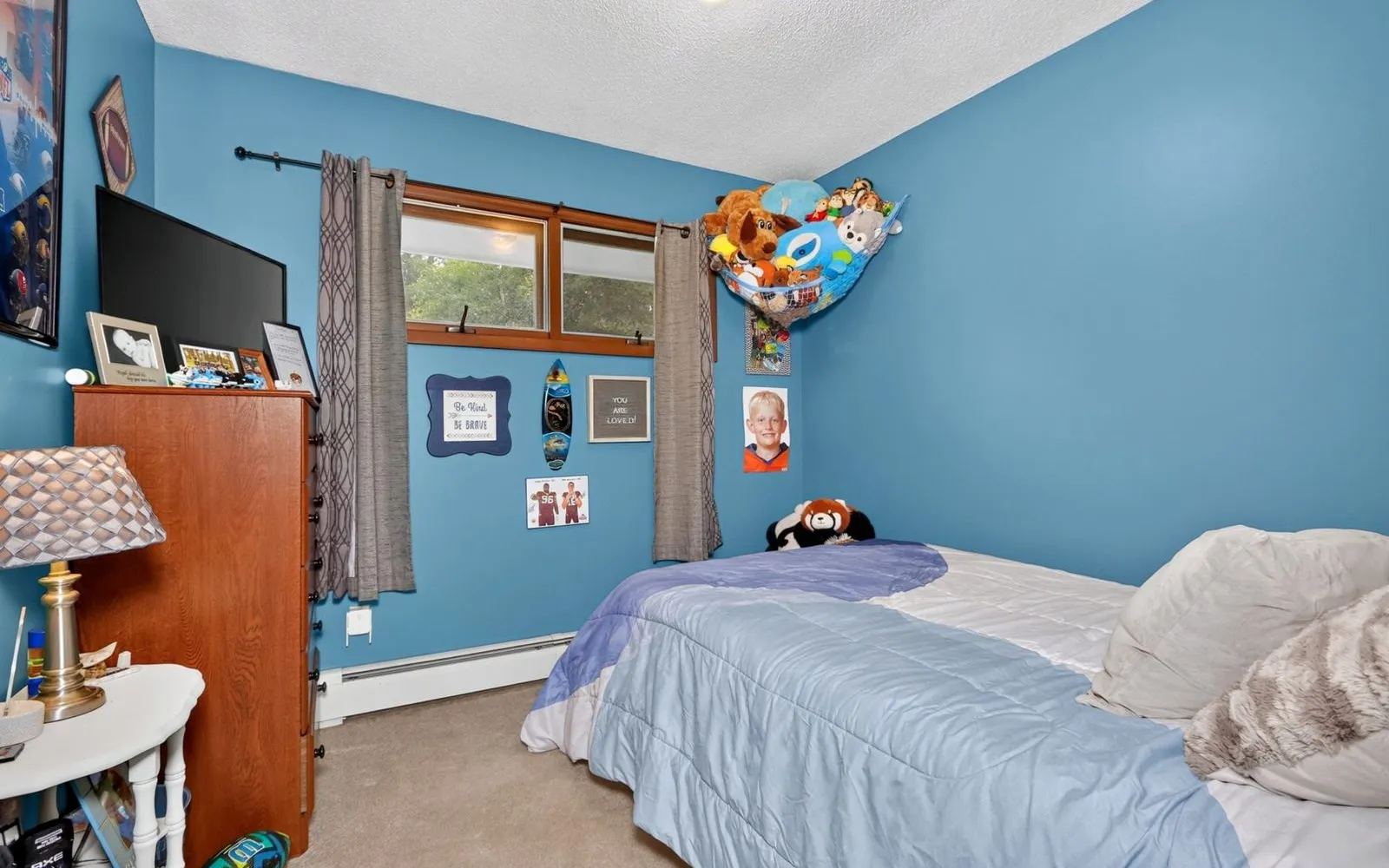 Bedroom with wood paneling