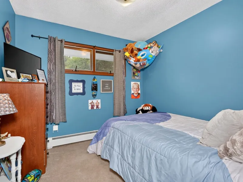 Bedroom with wood paneling