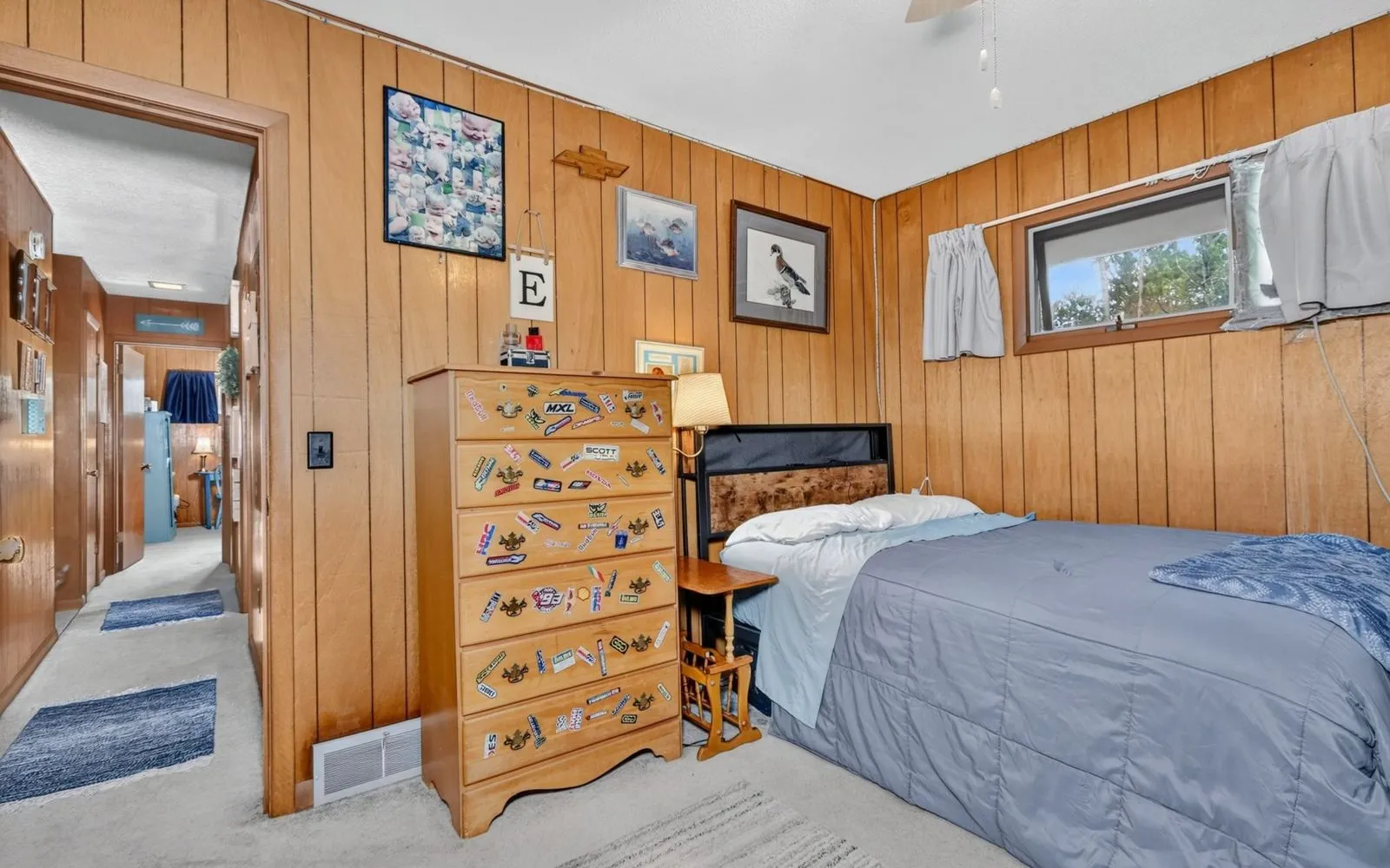 Wood-paneled room with a window