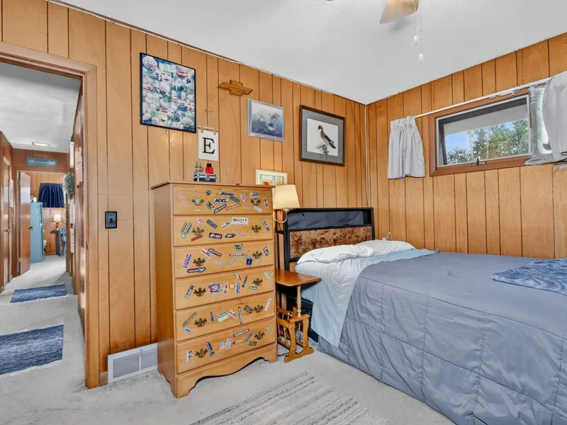 Wood-paneled room with a window
