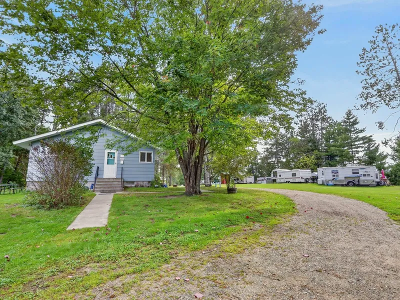 House exterior with Shallow Lake behind it