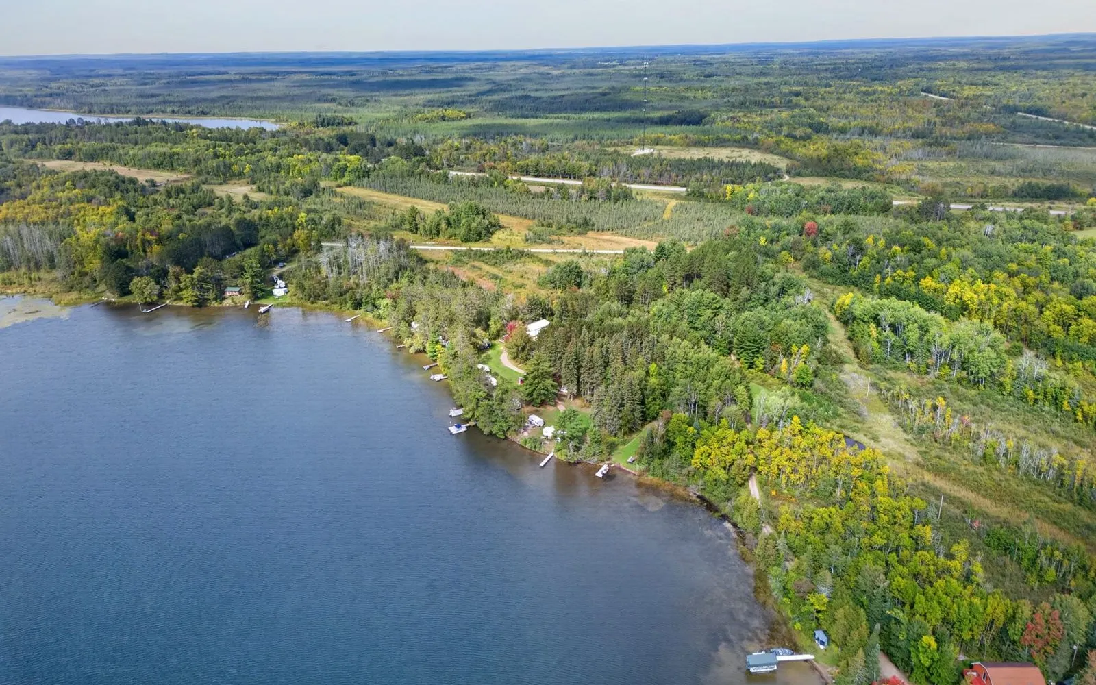 Aerial view of the property and the water