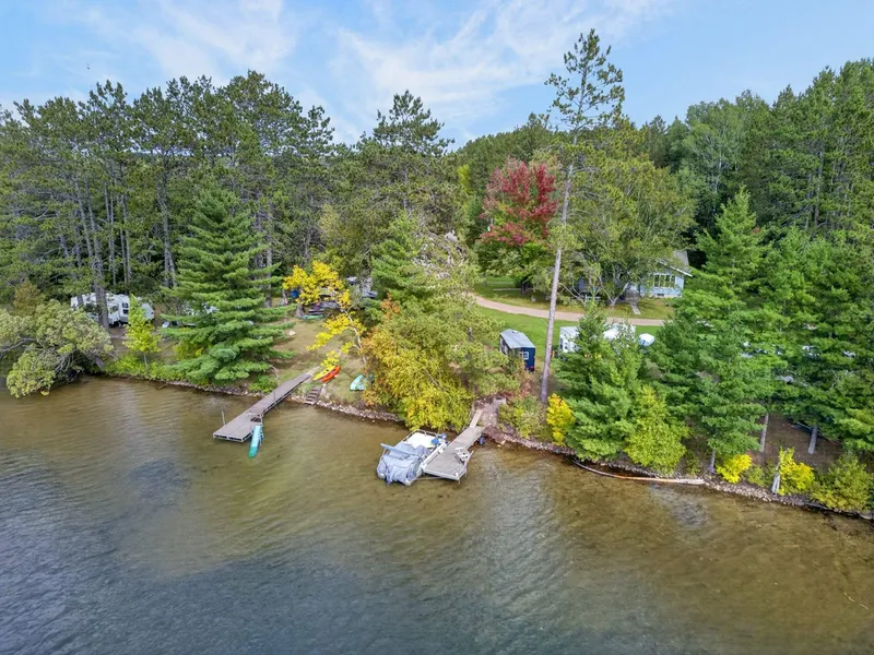 Aerial view of the house, shoreline, and docks on Shallow Lake