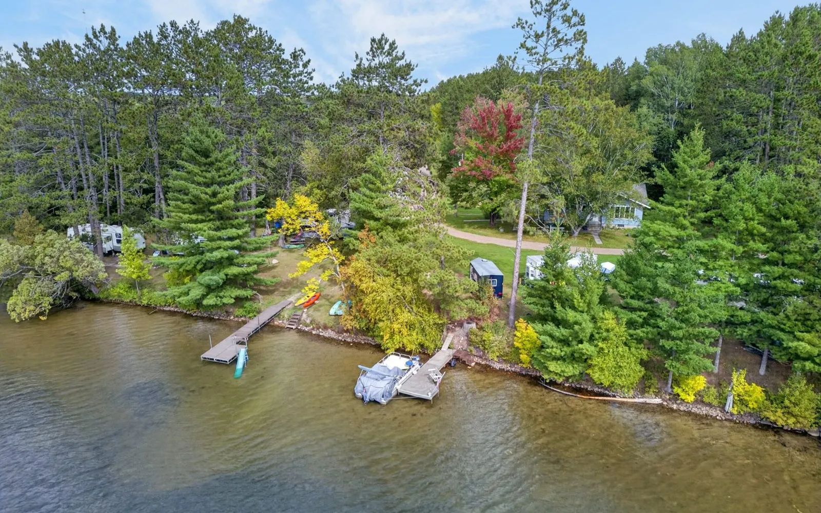 Aerial view of the house, shoreline, and docks on Shallow Lake